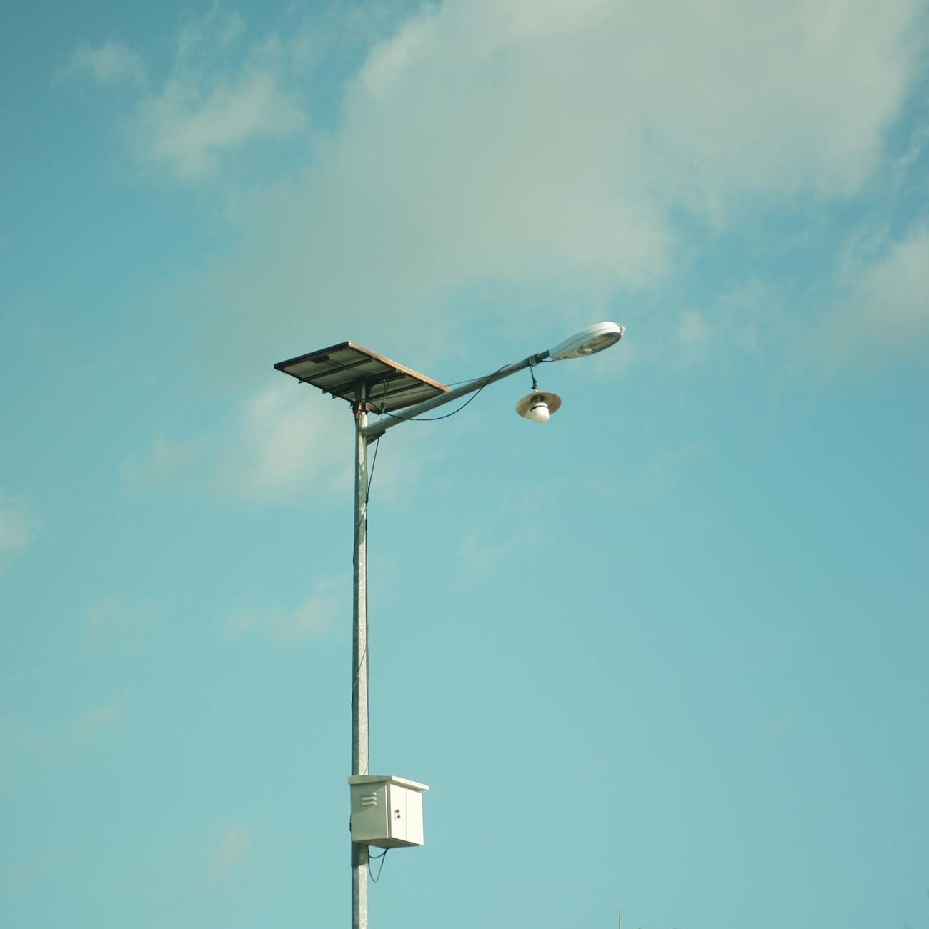 solar panel street light against blue sky